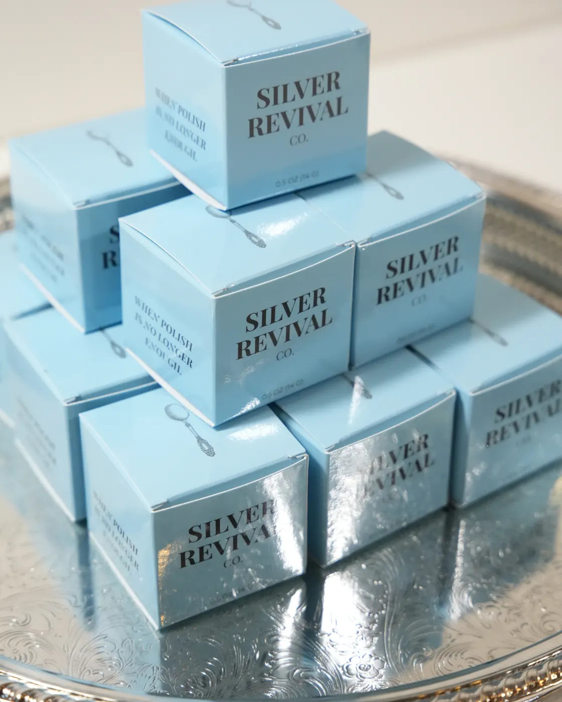 Silver Revival boxes stacked on a silver tray